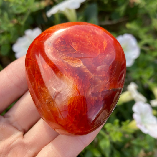 Red carnelian palm stone