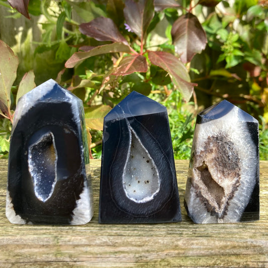 Sardonyx crystal towers displayed on a flat surface