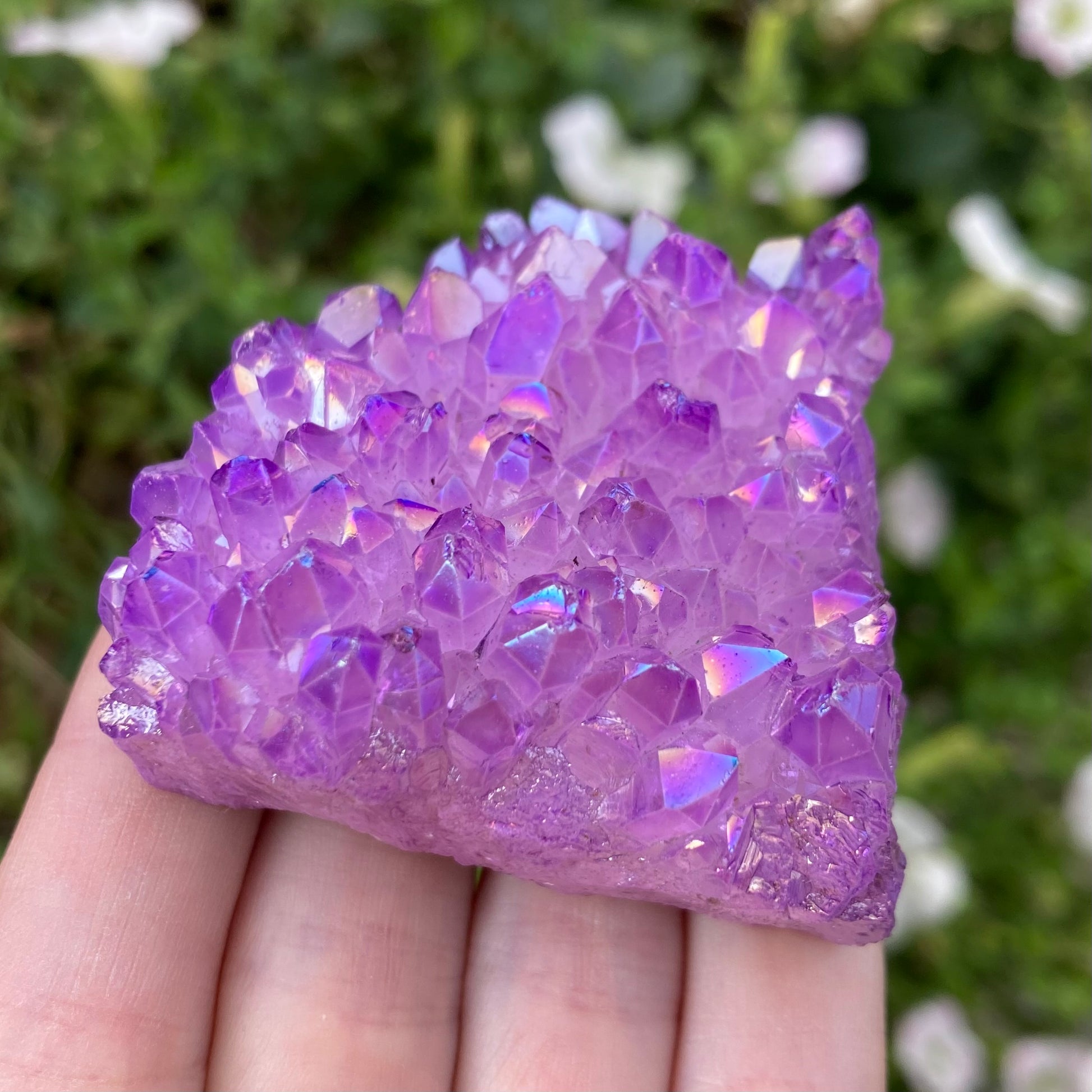 Multi faceted lavender aura quartz crystal