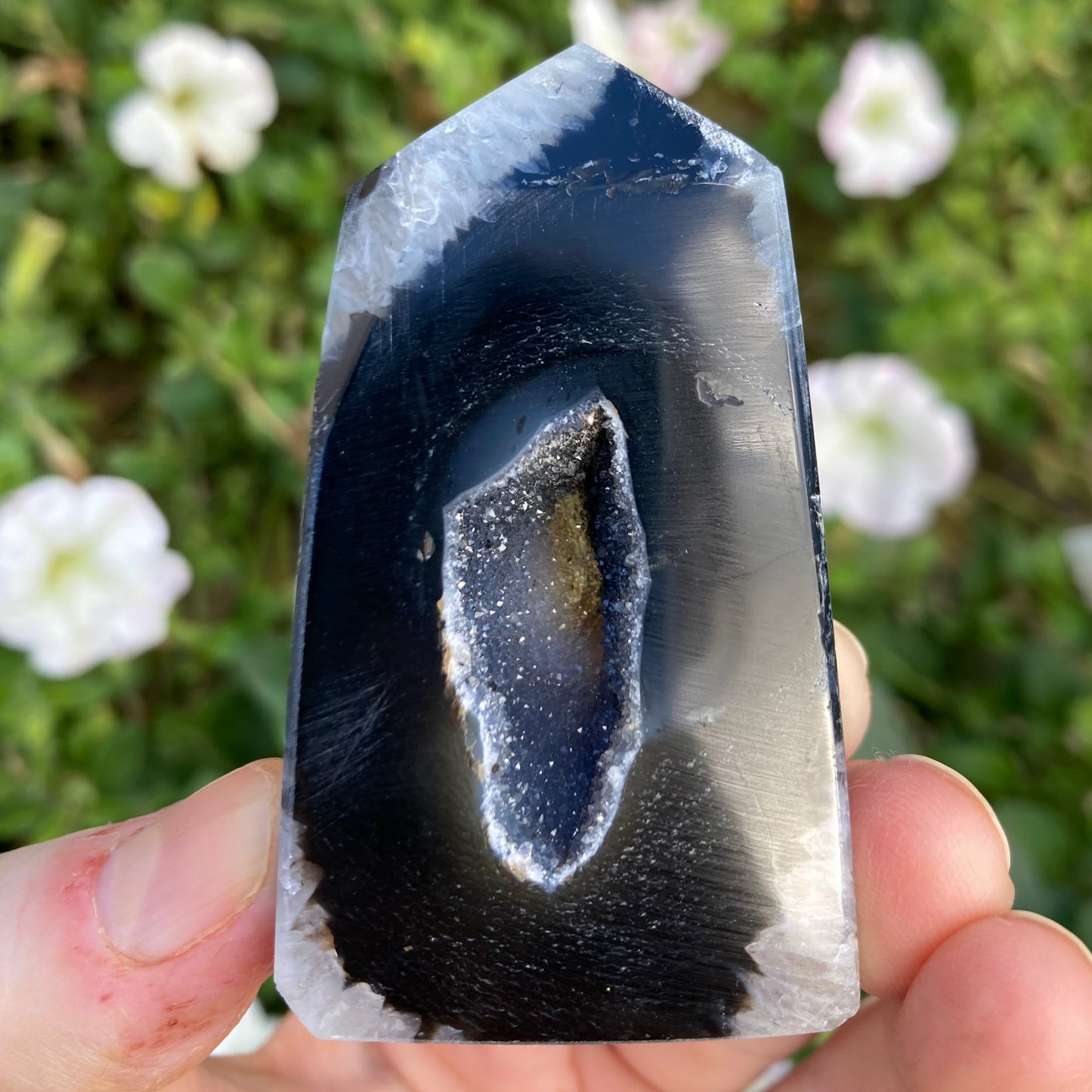 Polished sardonyx crystal point