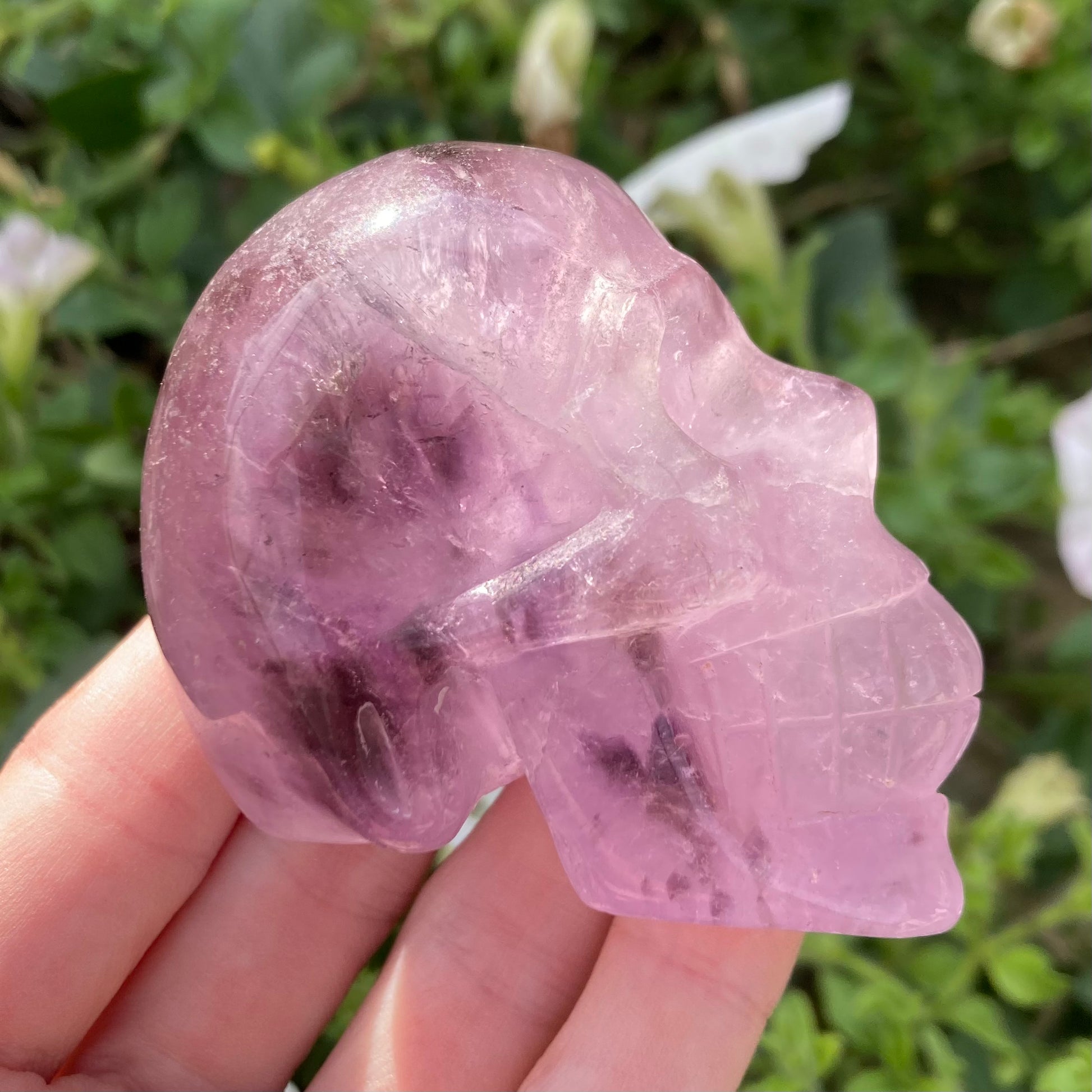 Polished amethyst skull head carving