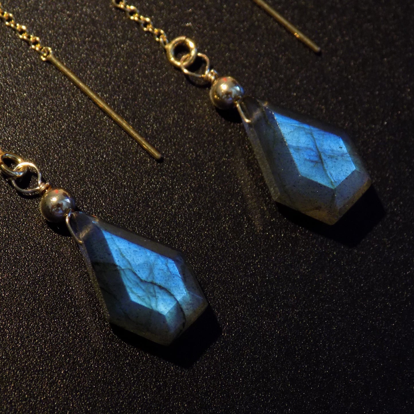 Close up of kite shape labradorite chain earrings