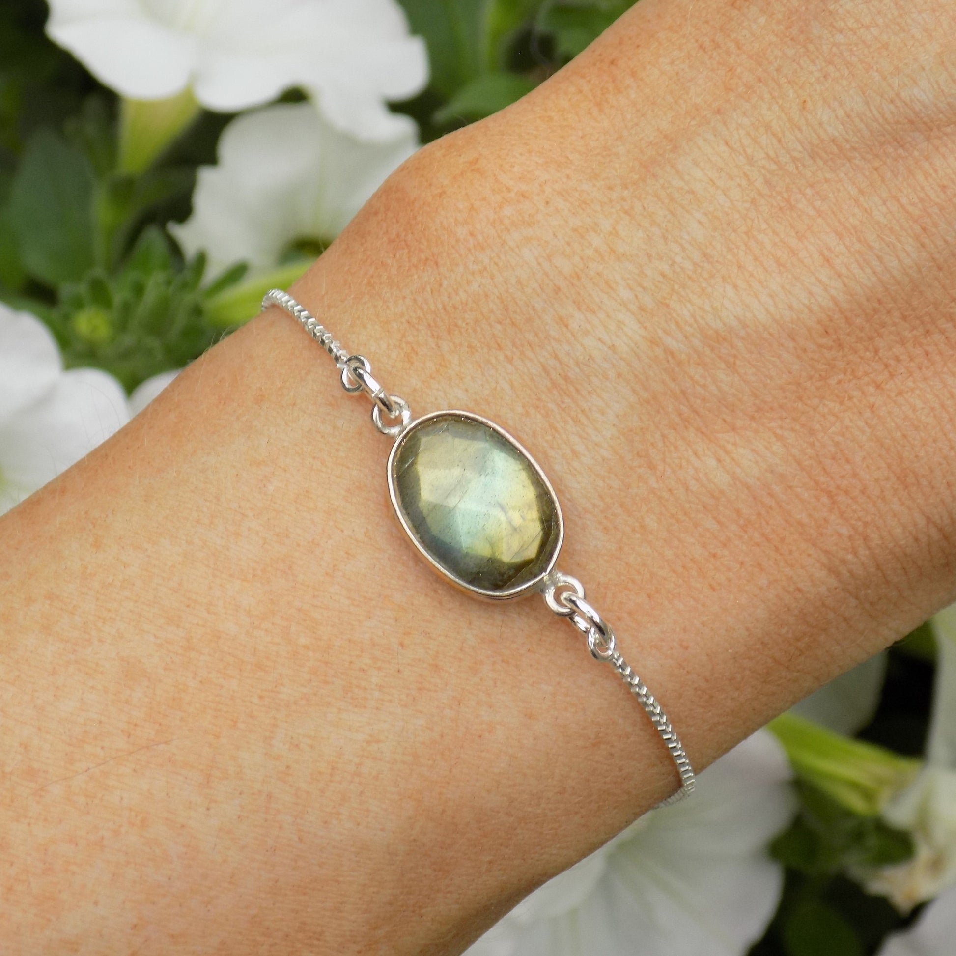 Faceted oval labradorite bracelet on model