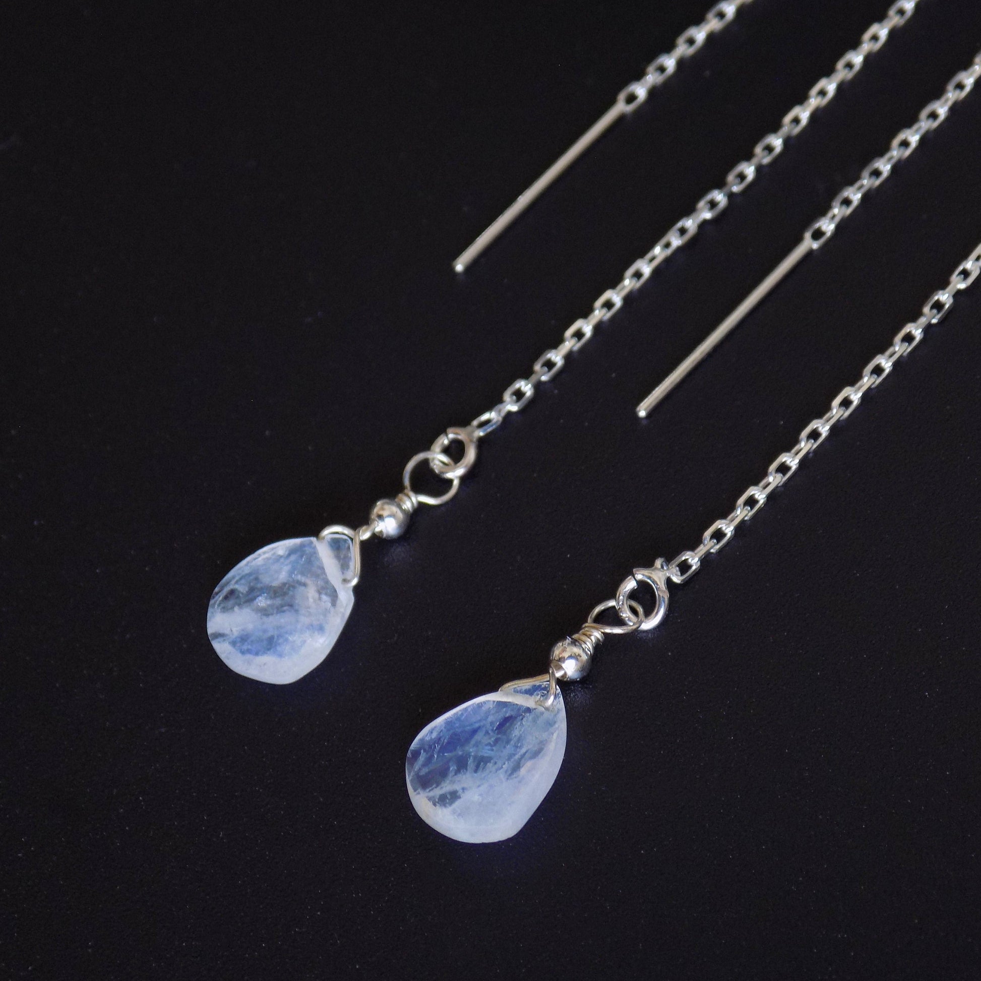 Moonstone teardrop earrings showing blue flash