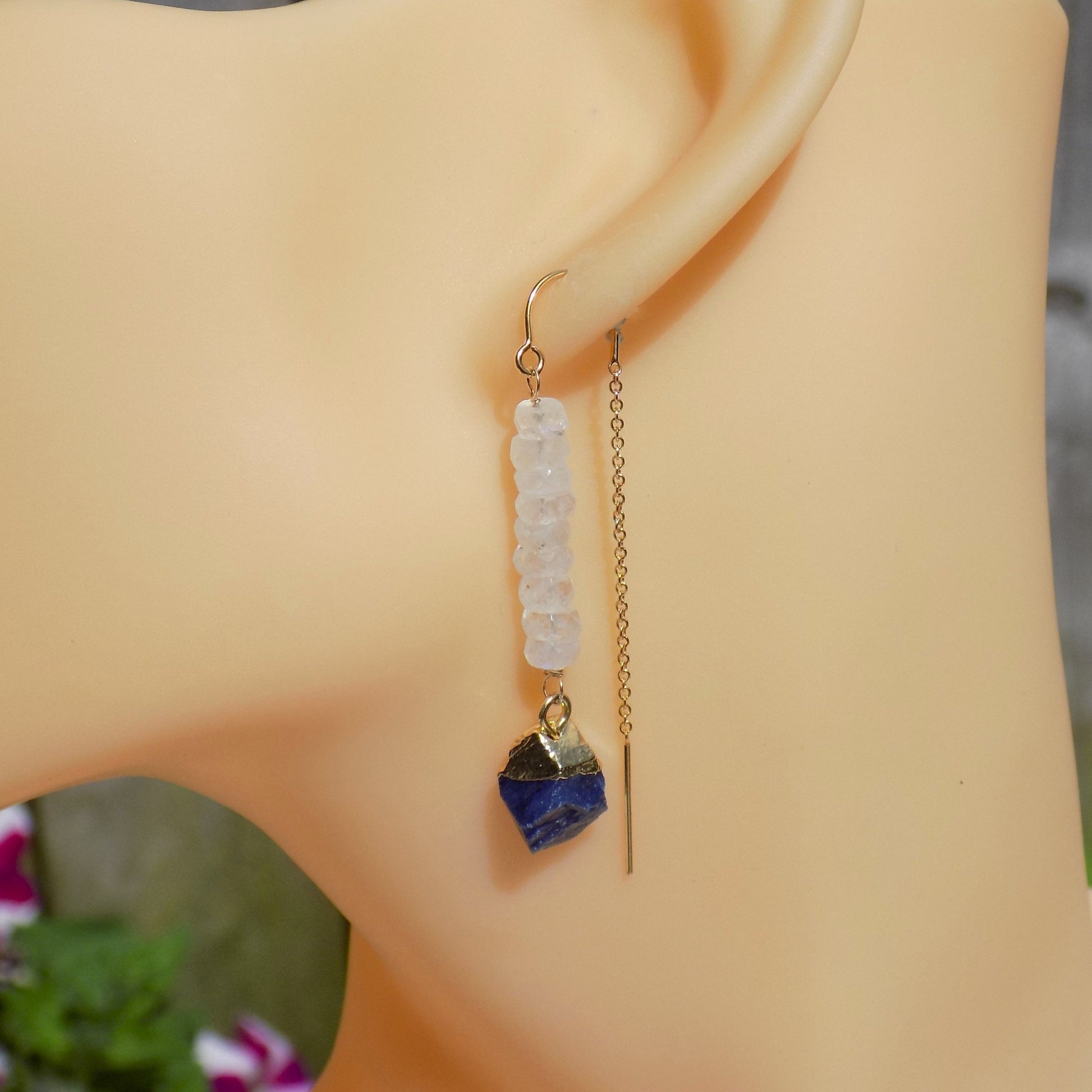 Long sapphire and rainbow moonstone earrings on model