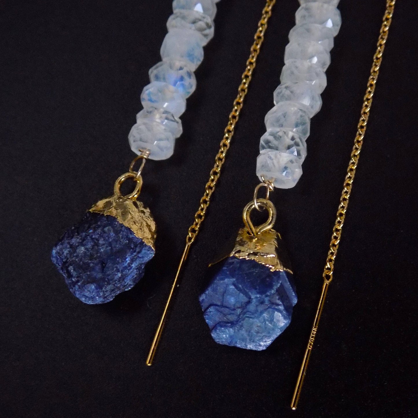 Close up of rough sapphire gemstones on threader earrings